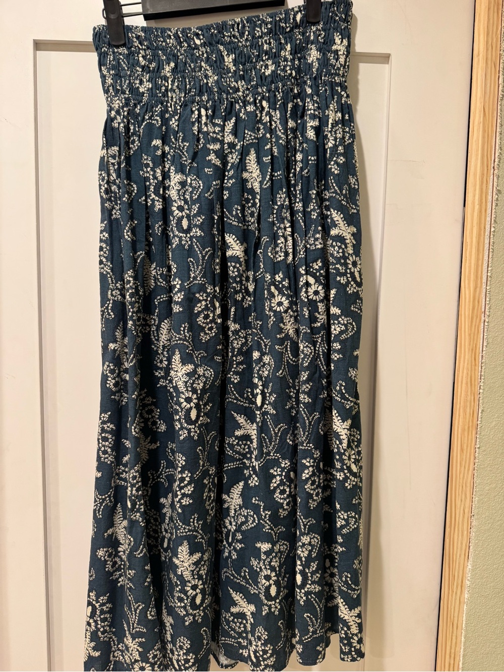 THE GREAT. Navy and White Floral Smocked Midi Skirt - Picture 2 of 5